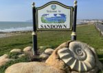 Welcome to Sandown sign with bay in the background - Paul Coueslant