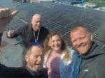 All smiles on the roof of Lanesend Primary as Solar panels fitted