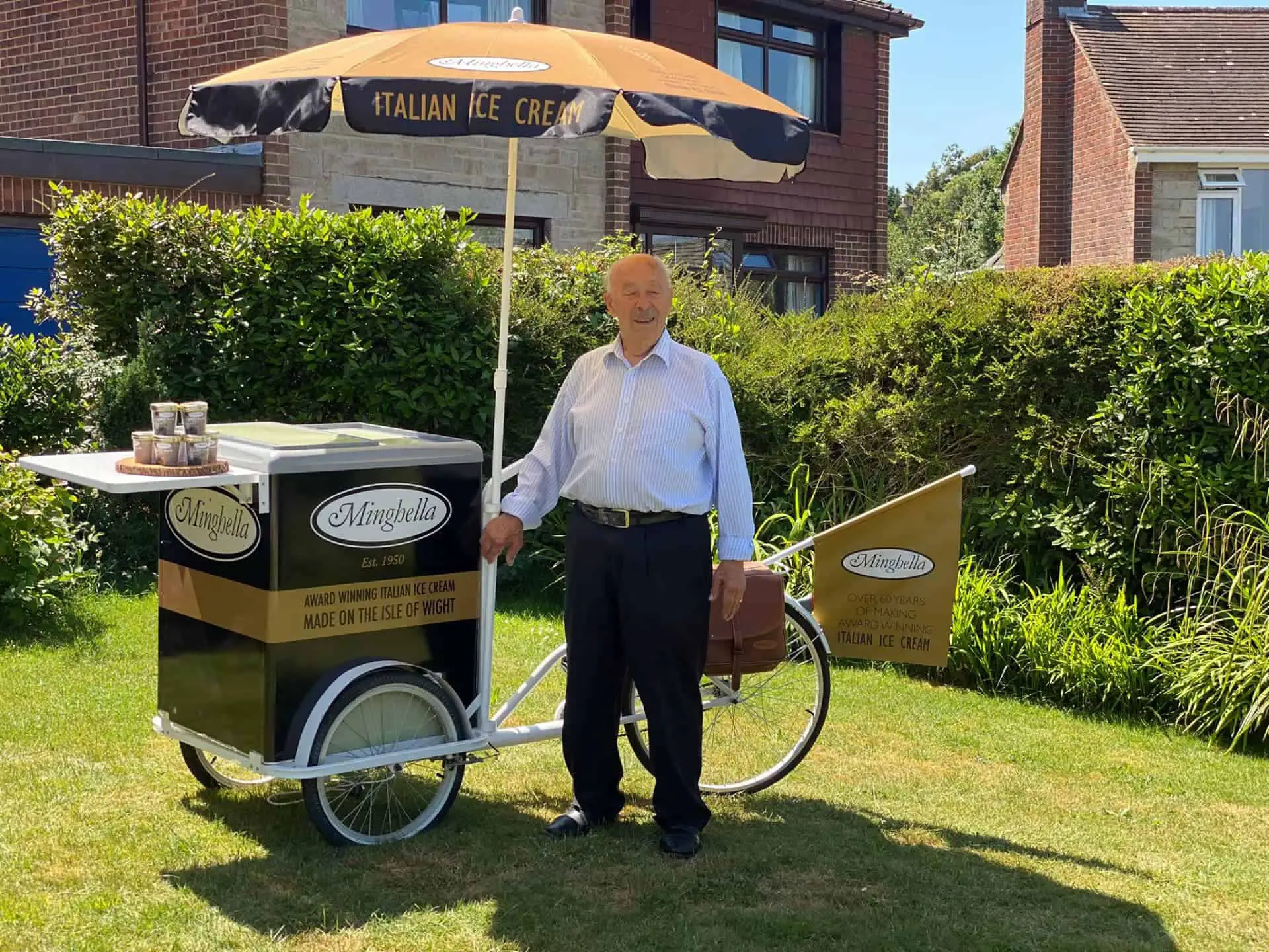 Eddie Minghella standing by his ice cream bicycle