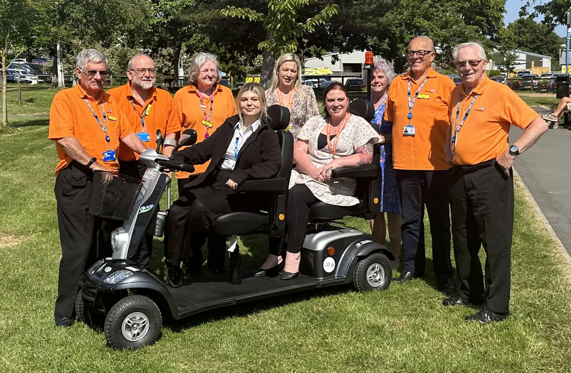 Volunteers with the new patient buggy