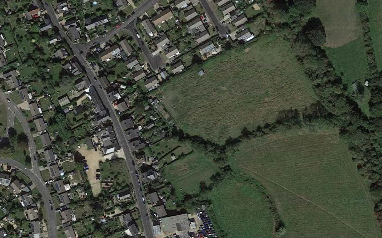 Aerial shot of the field where houses are planned