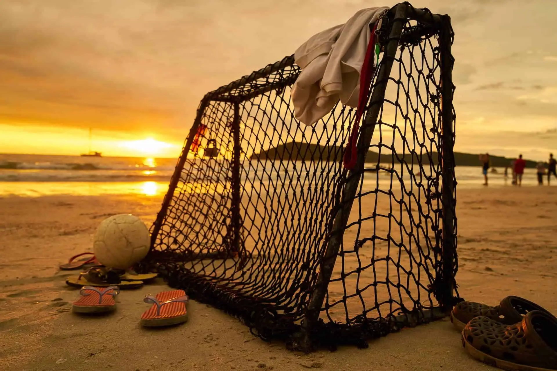 Beach soccer goal with sunset in background