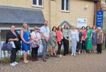 Staff and Dame Andrea standing outside the Ryde Family Hub