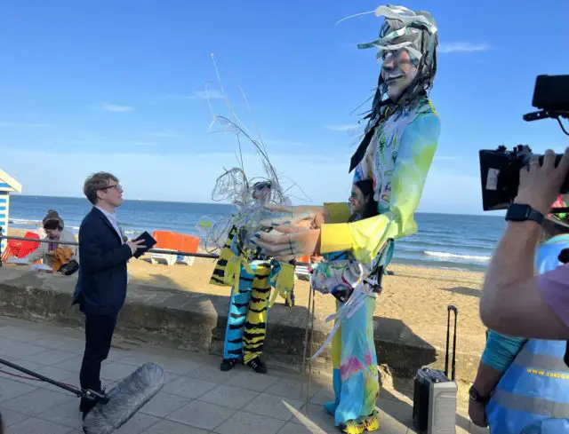 TV star Josh Widdicombe interviews Sandown Carnival entrant and fashion graduate Joel Lines