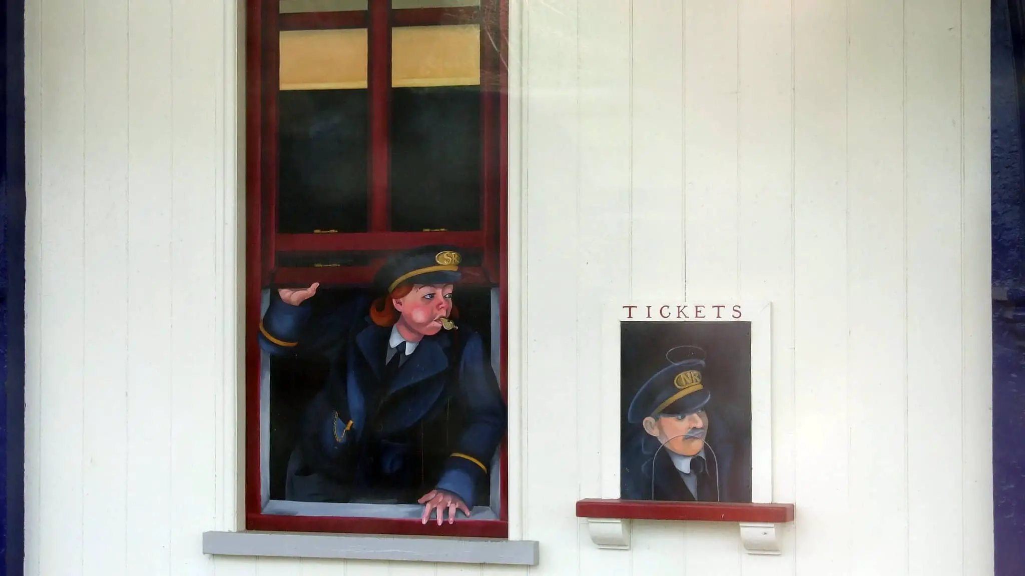 Painting of railway staff at ticket office windows