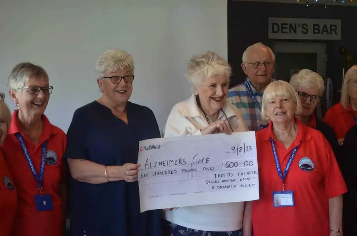 Maggie Bennett, CEO, Alzheimer Cafe being presented with a cheque for £600 by CAODS President, Dinah Bowman