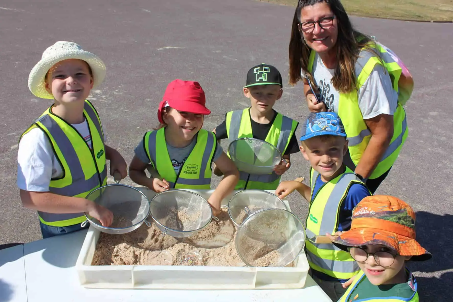 Vanessa Skipper and pupils from Dover Park Primary search for microplastics on Ryde beach