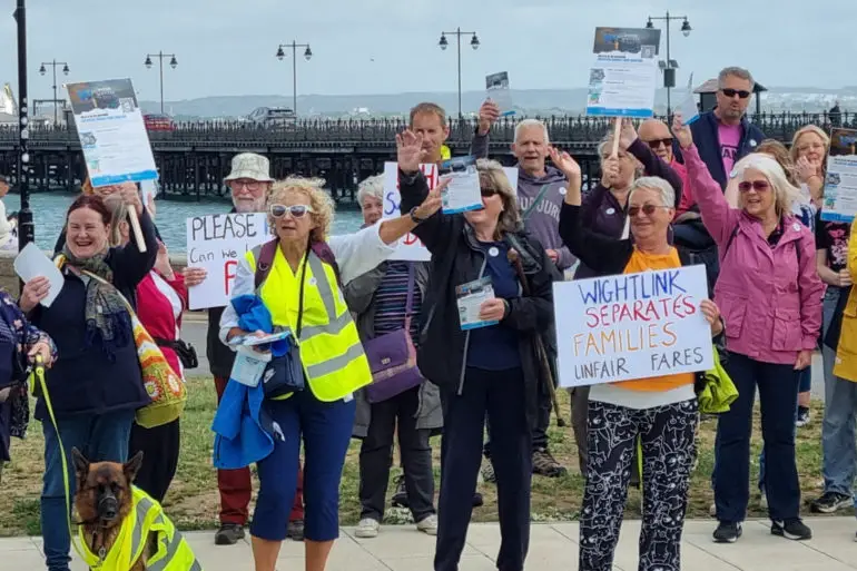 Members of the Wightlink users group protesting by the pier