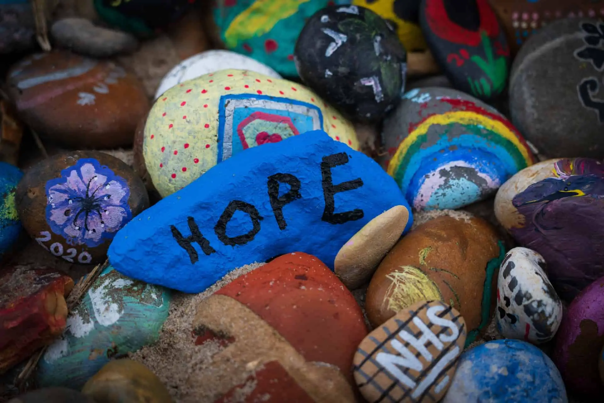 Painted pebbles with NHS and hope written on them