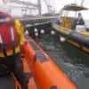 Lifeboat helps joins in the effort to bring the vessel to safety