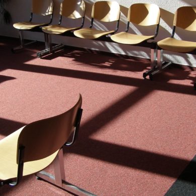 Seats in a waiting room with sun shining through the window