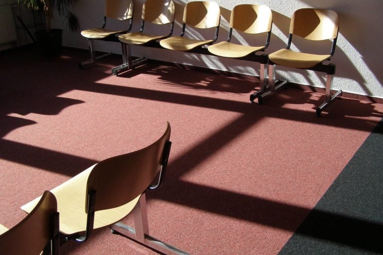 Seats in a waiting room with sun shining through the window