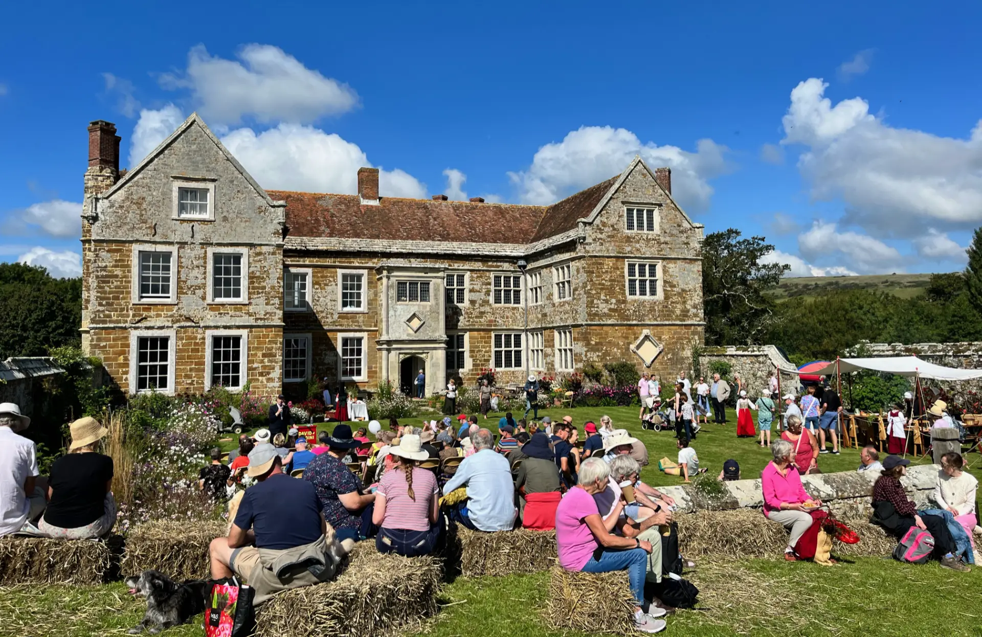 People enjoying Wolverton Manor Garden Fair in the sun