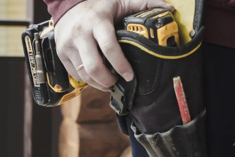 carpenter with tool belt on