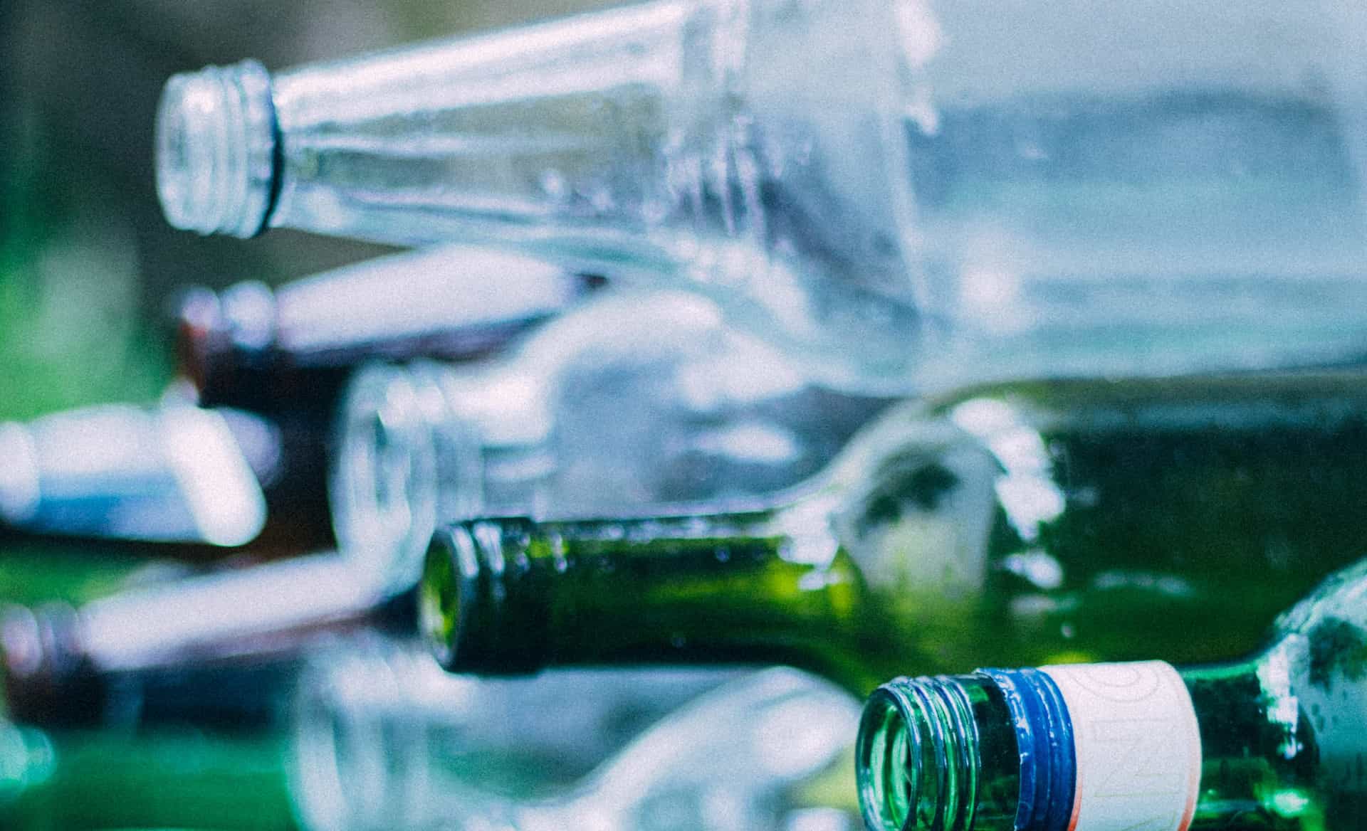 glass bottles stacked for recycling