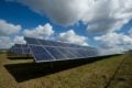 solar farm with blue skies in background