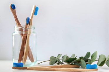 Bamboo toothbrushes in a jar