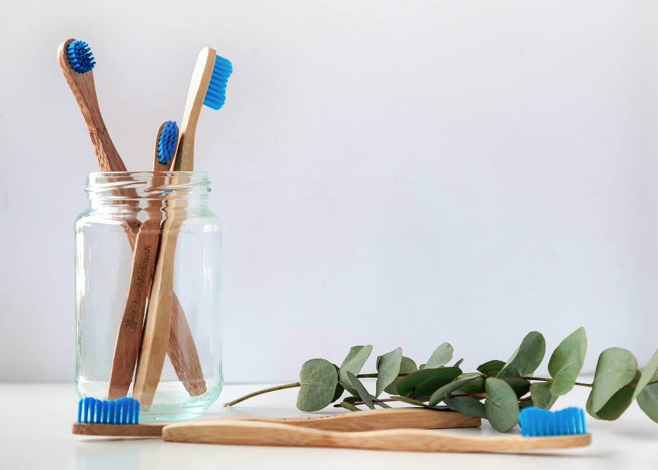 Bamboo toothbrushes in a jar