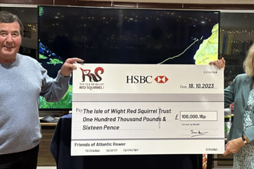 Atlantic Rower presenting a cheque for £100,000.16p to The Chair of the Isle of Wight Red Squirrel Trust
