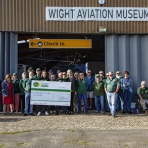 Giant cheque and members of Isle of Wight branch of the Jaguar Enthusiasts' Club