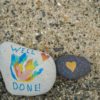 Pebbles painted with well done messages