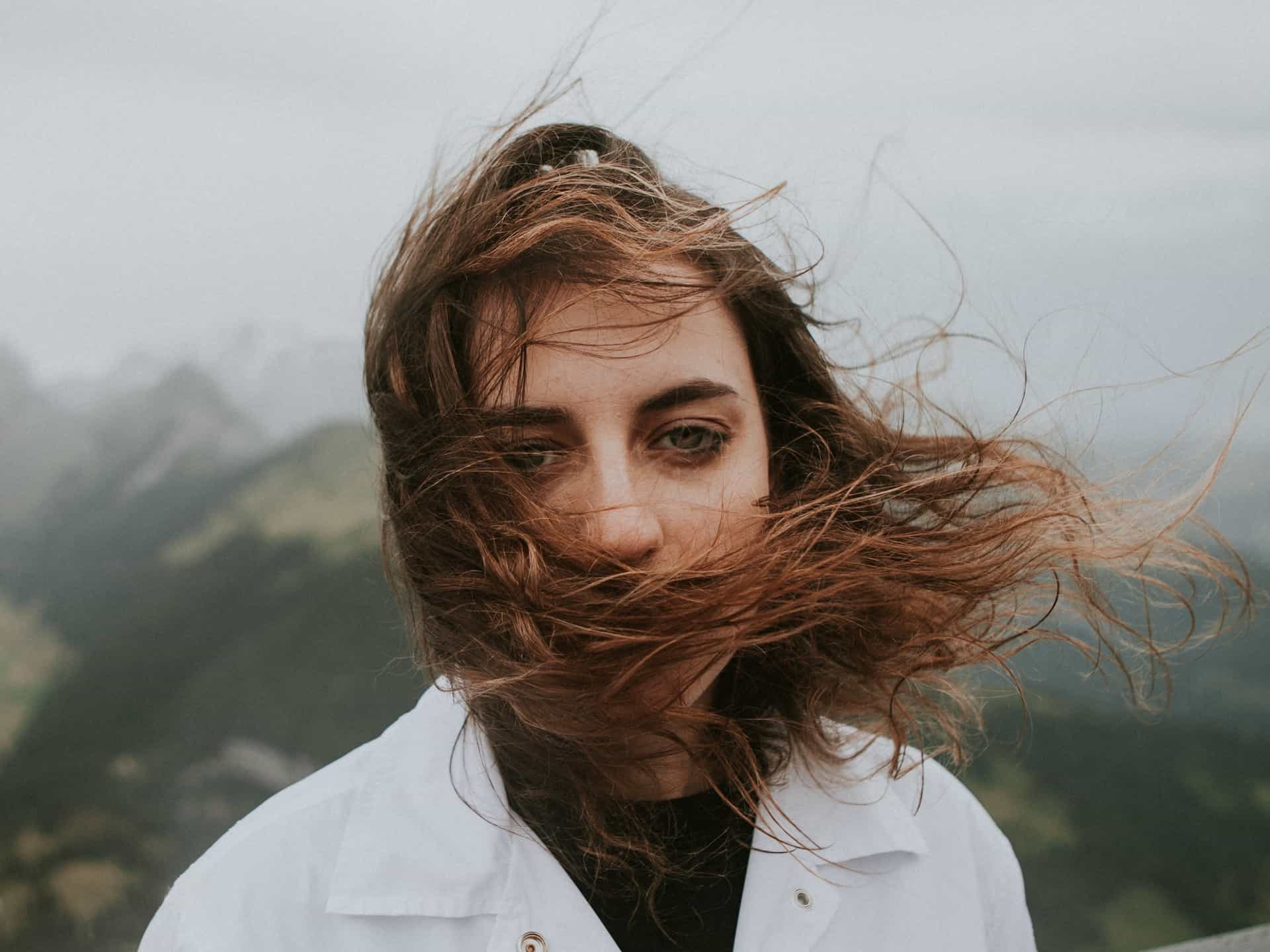 Person with blowing hair in wind