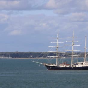 SV Tenacious passing Fort Victoria by Richard Cattle