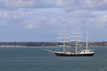 SV Tenacious passing Fort Victoria by Richard Cattle
