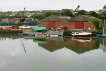 Photo of blackhouse quay warehouses from across the river