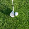 golf club and ball on grass