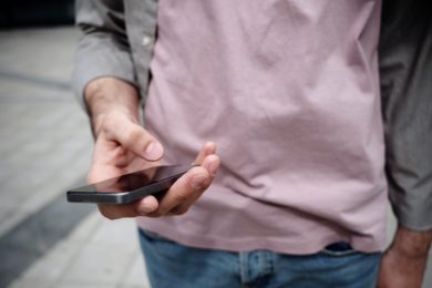 man holding mobile phone