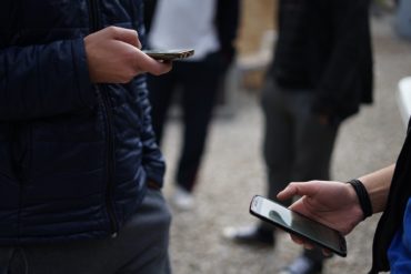 teenagers on mobile cell phones