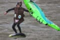 Jibi Boulton kitesurfing in poo emoji suit by Clive Blount