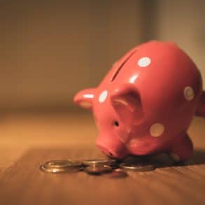 Pink elephant piggy bank with coins emptied out of it