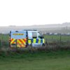 Police van in countryside