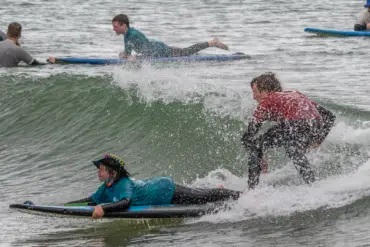 Young People surfing as part of the Wave Project