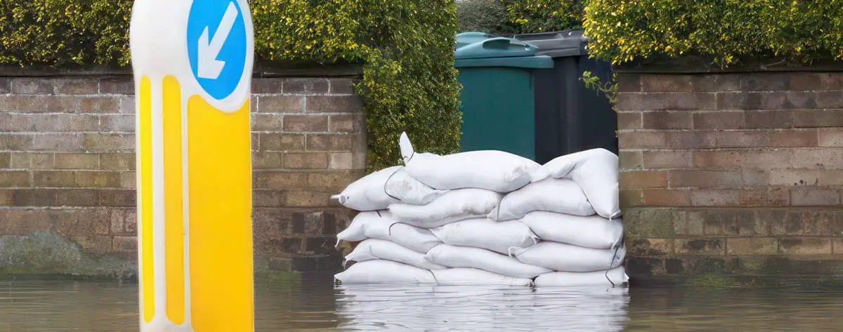 flooding and sandbags at entrance to garden