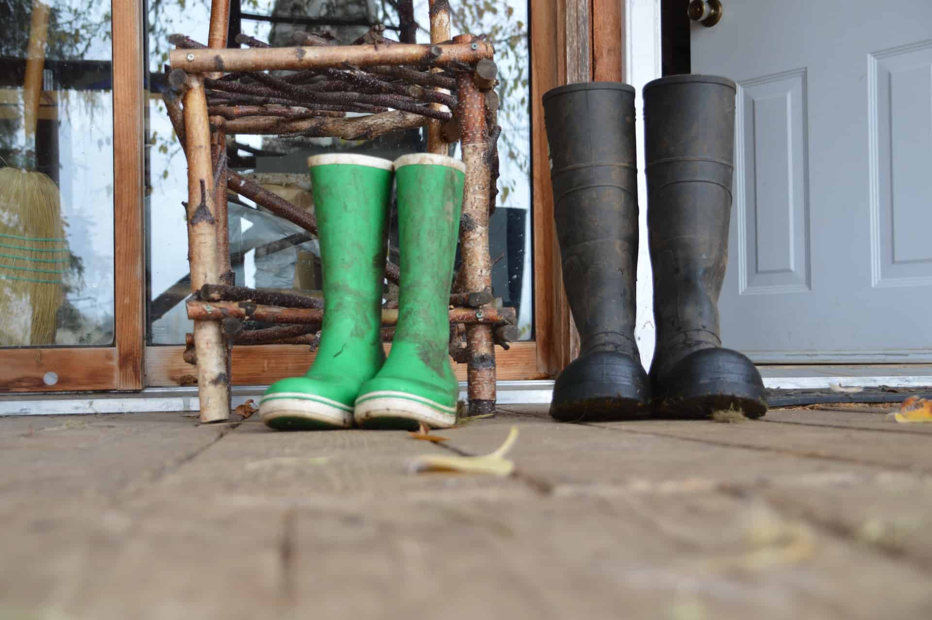 two pairs of wellies on porch
