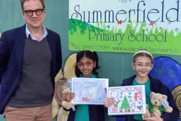 Bob Seely with Aysha and Bella and their winning xmas card designs