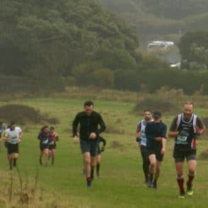 Runners taking on the Chilly Hilly Tennyson Climb in the mist