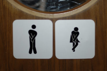 Crossed leg toilets sign by advencap