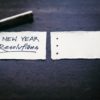 Pen and paper, with News Year Resolutions written on it