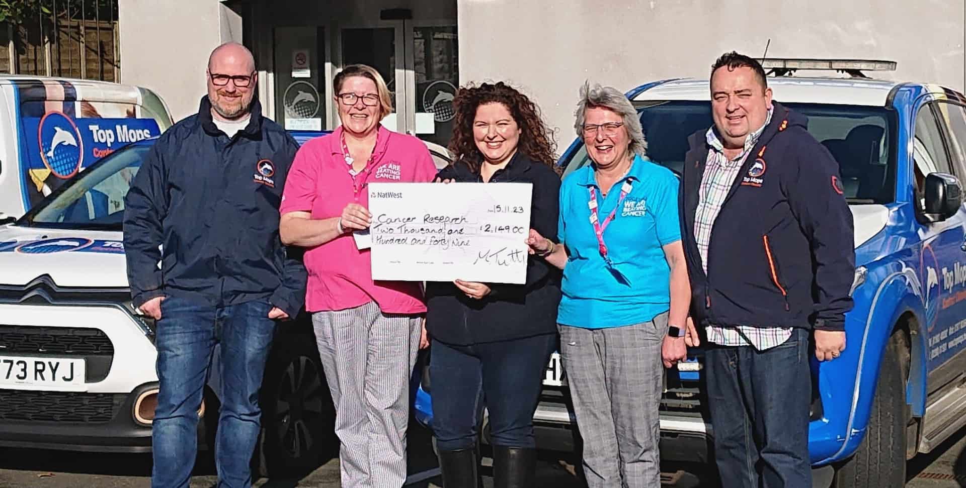 L-R: Craig Ford (Top Mops Director, Sarah Porter (Cancer Research Volunteer Committee), Sarah Ford (Top Mops Relationship Manager), Jayne Bowater (Cancer Research Volunteer Event Chair) and Mark Tutty (Top Mops Founder and Managing Director)