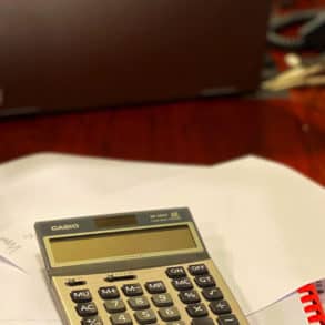 calculator on top of papers