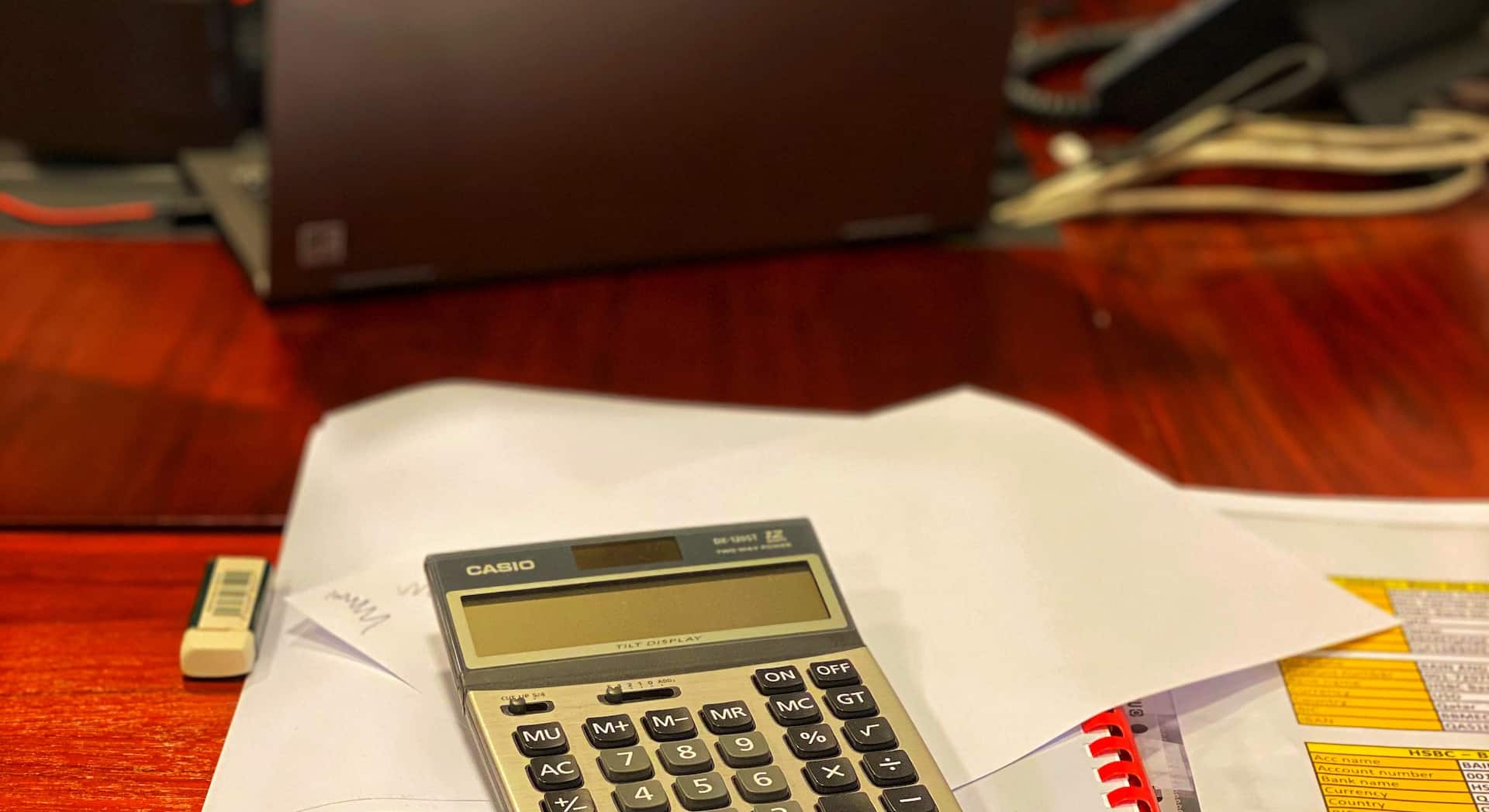 calculator on top of papers