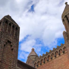 The top of quarr abbey with blue sky behind