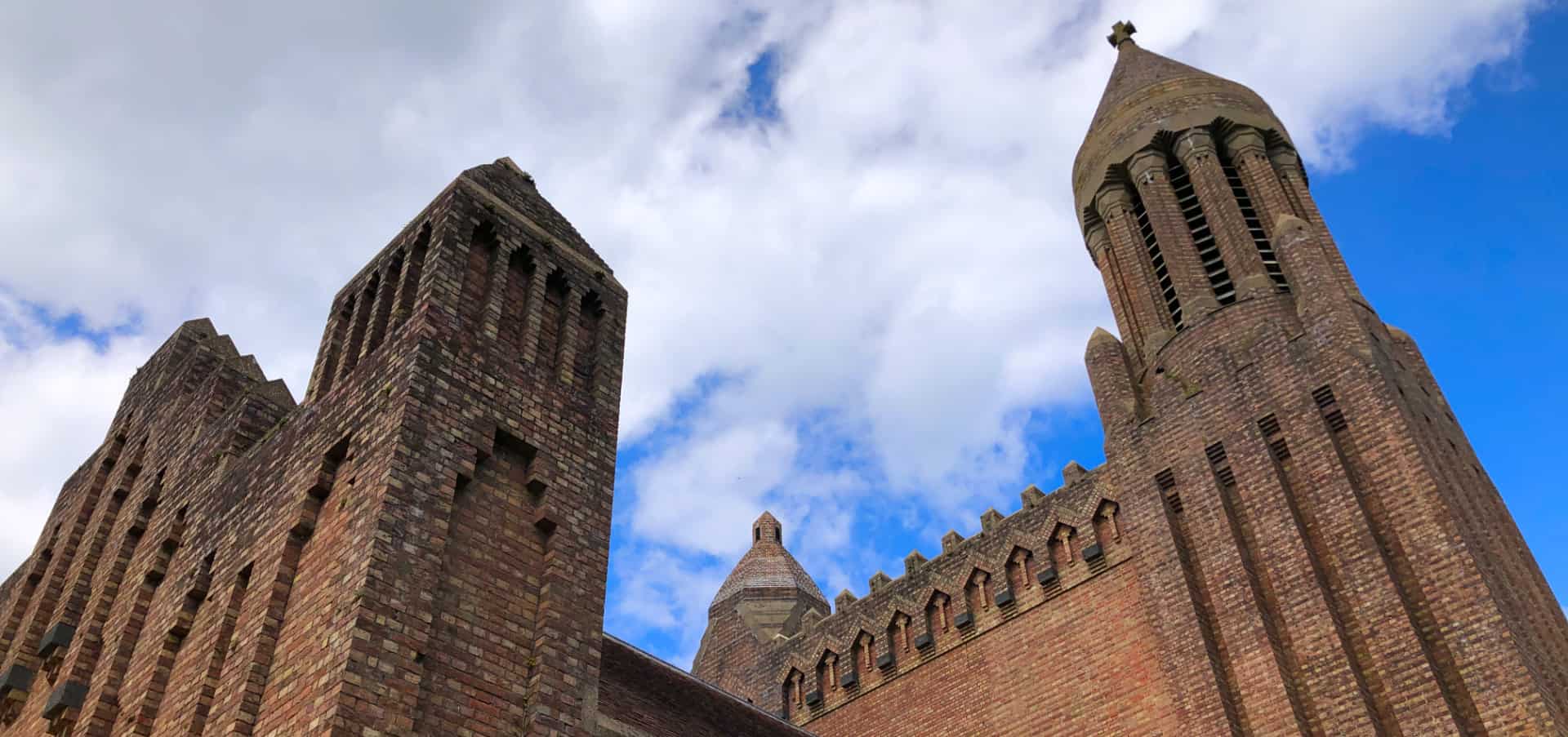 The top of quarr abbey with blue sky behind