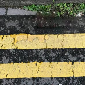 Double yellow lines on the roadside