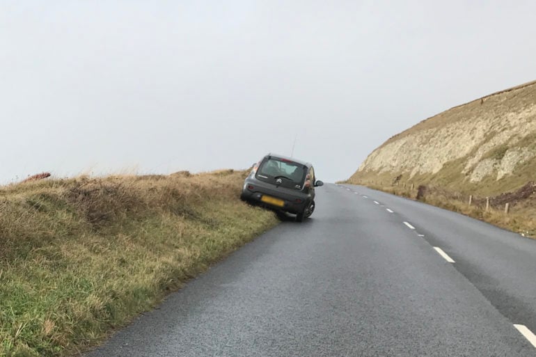 F35, car parked on verge by Christ Jarman