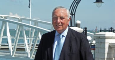 George Brown standing by the water in Cowes